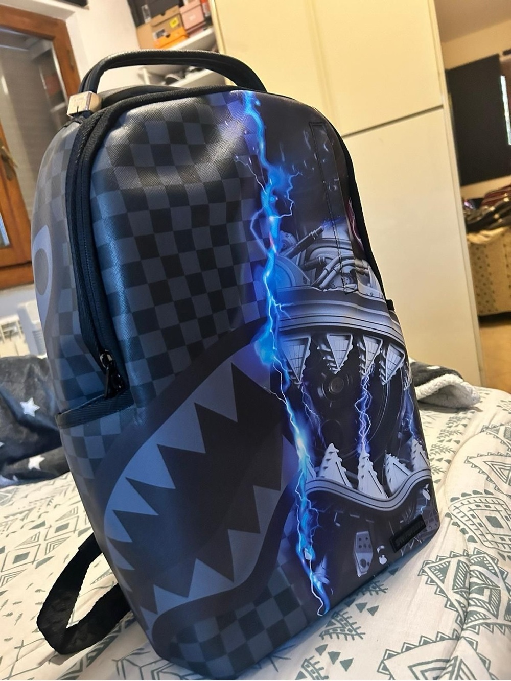 Sprayground Black Backpack with Electric Blue Lightning Graphic
